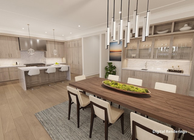 dining room with sink and light hardwood / wood-style flooring