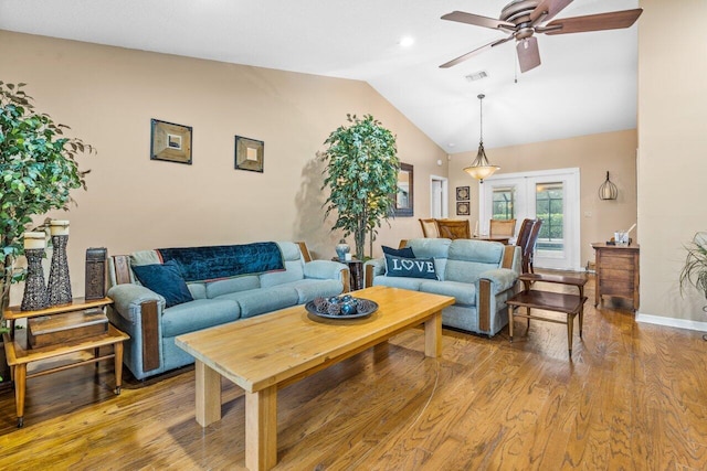 living room with french doors, lofted ceiling, ceiling fan, and light hardwood / wood-style flooring