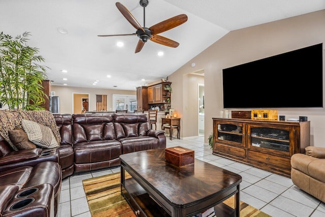 living room with vaulted ceiling, light tile flooring, and ceiling fan