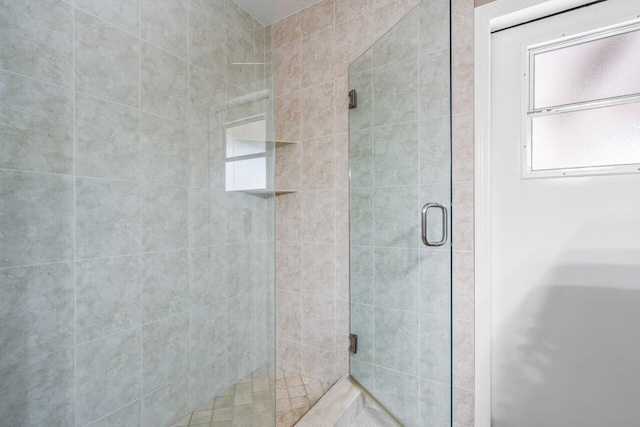 bathroom featuring an enclosed shower