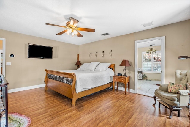 tiled bedroom featuring ceiling fan