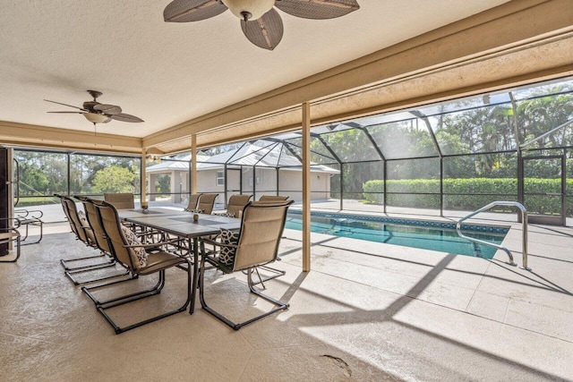 sunroom with a healthy amount of sunlight and ceiling fan