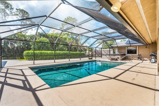 view of pool featuring a lanai and a patio area