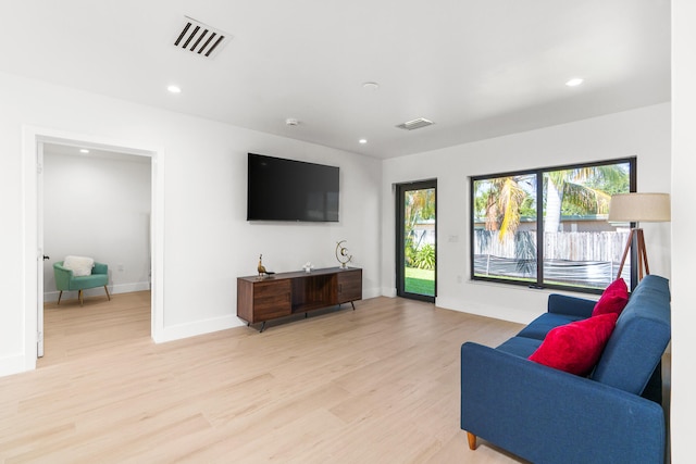 living room with light hardwood / wood-style floors