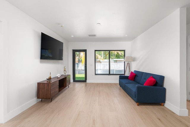 sitting room featuring light hardwood / wood-style flooring