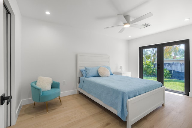 bedroom with ceiling fan, access to exterior, light hardwood / wood-style flooring, and french doors