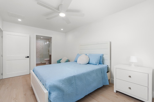 bedroom with ceiling fan, light hardwood / wood-style flooring, and ensuite bathroom