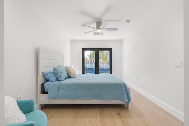 bedroom with french doors, access to exterior, ceiling fan, and hardwood / wood-style floors