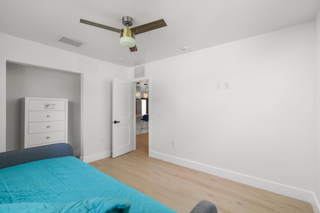 unfurnished bedroom featuring ceiling fan and light hardwood / wood-style flooring