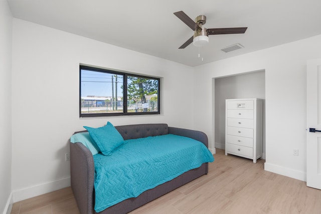 bedroom featuring ceiling fan and light hardwood / wood-style floors