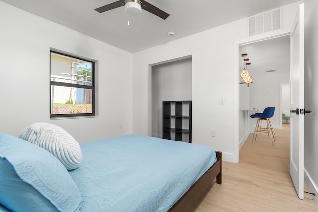 bedroom featuring ceiling fan and light hardwood / wood-style flooring