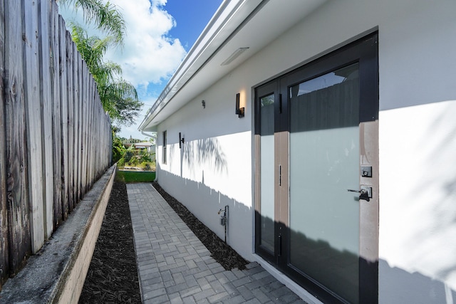 view of side of home with french doors