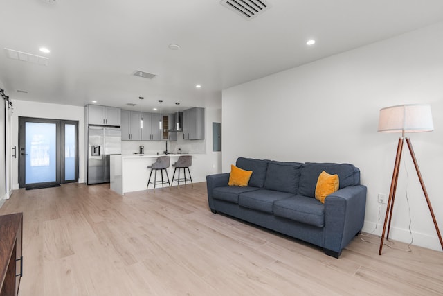 living room with light hardwood / wood-style flooring