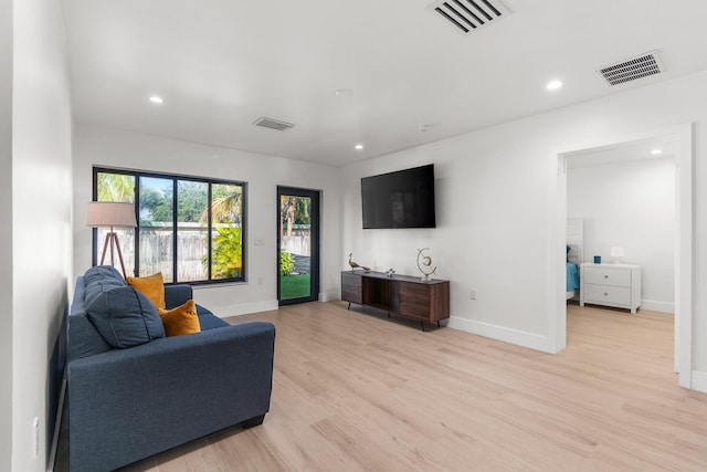 living room with light hardwood / wood-style flooring