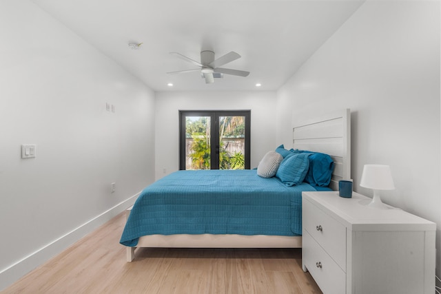 bedroom with french doors, ceiling fan, and light hardwood / wood-style flooring