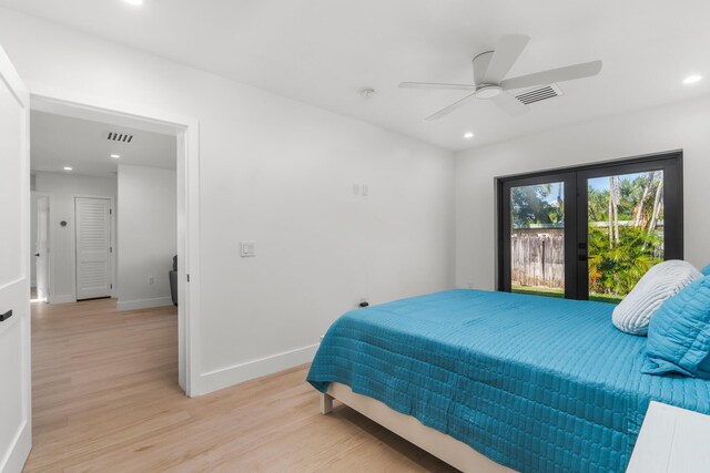 bedroom with french doors, ceiling fan, and light hardwood / wood-style flooring