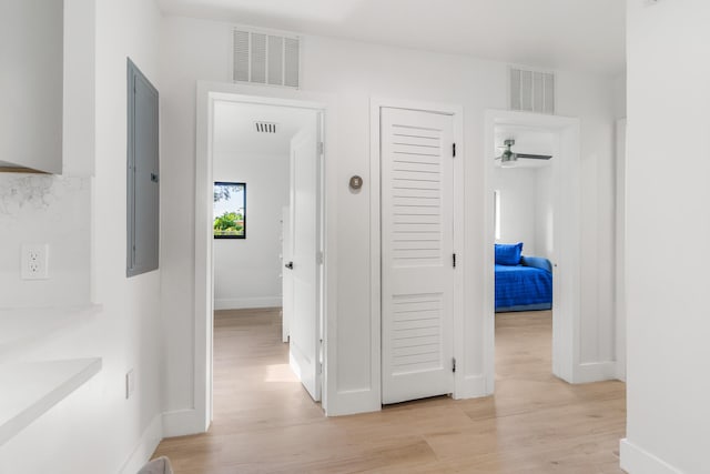 hall with light hardwood / wood-style floors