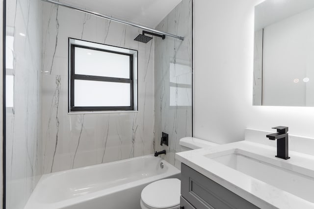 full bathroom featuring tiled shower / bath combo, vanity, and toilet