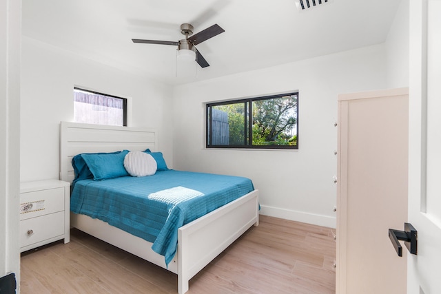 bedroom featuring light hardwood / wood-style floors and ceiling fan