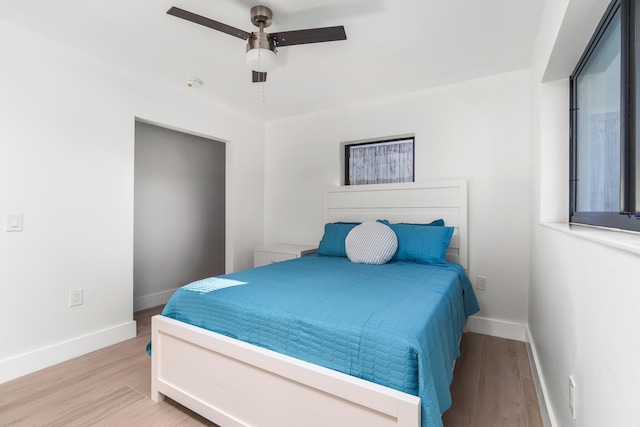 bedroom featuring ceiling fan and hardwood / wood-style floors