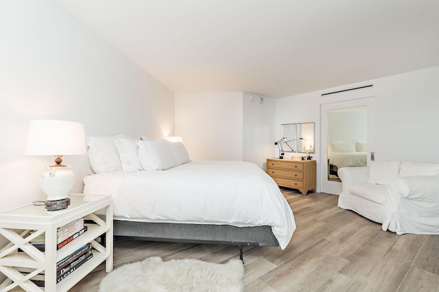 bedroom with light wood-type flooring