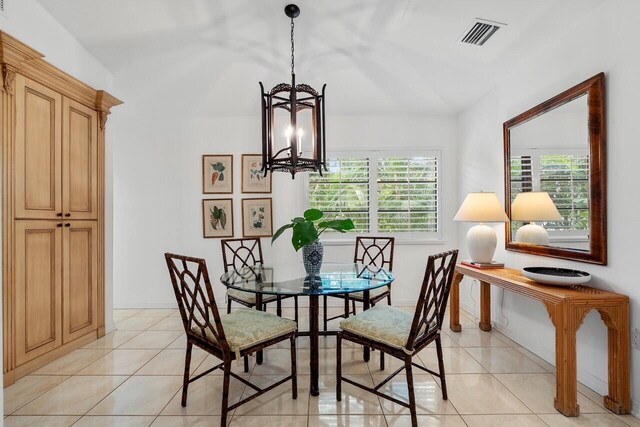 tiled living room with lofted ceiling and a fireplace