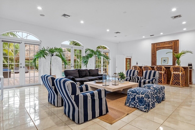 tiled living room featuring french doors