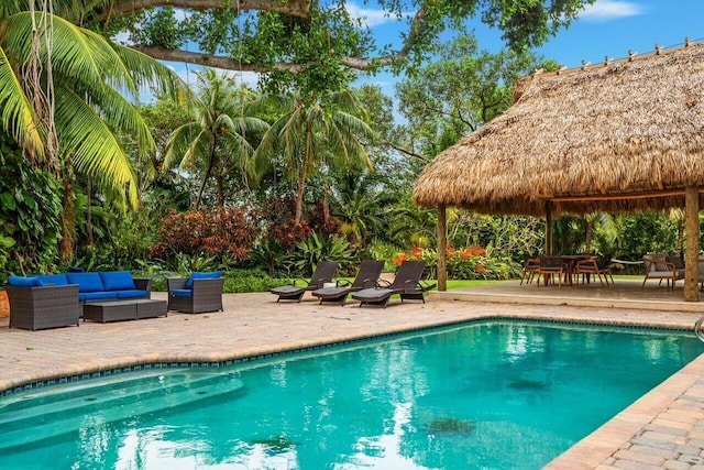 view of swimming pool featuring a patio area, outdoor lounge area, and a gazebo