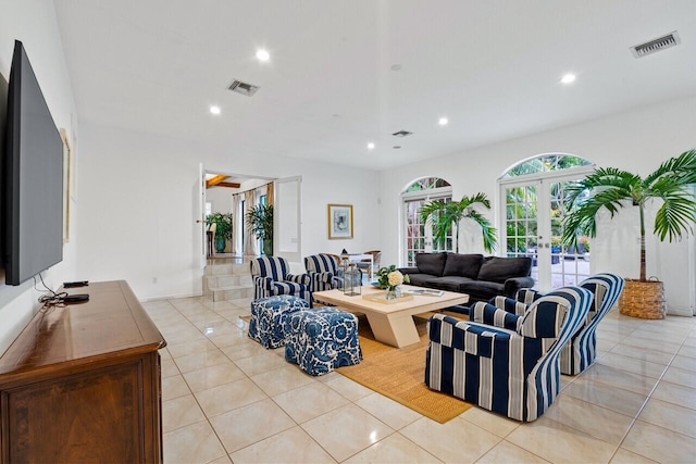 living room with light tile patterned floors and french doors