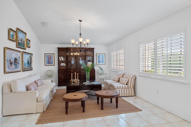 living room with light tile patterned floors, lofted ceiling, and a chandelier