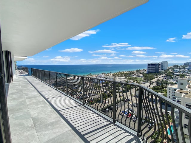 balcony with a water view and a city view