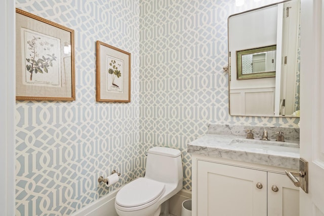 bathroom with vanity and toilet