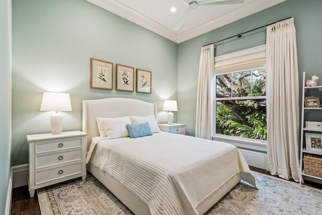 bedroom with ornamental molding and light hardwood / wood-style flooring