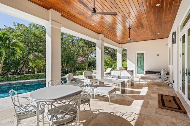 view of patio / terrace with an outdoor living space and ceiling fan