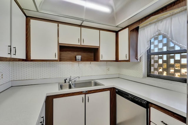 kitchen with white cabinetry, sink, and stainless steel dishwasher