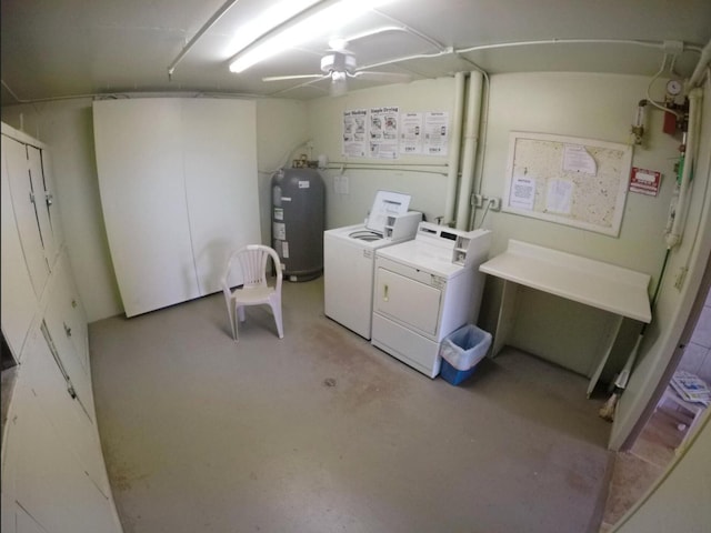 basement featuring washing machine and clothes dryer, electric water heater, and ceiling fan