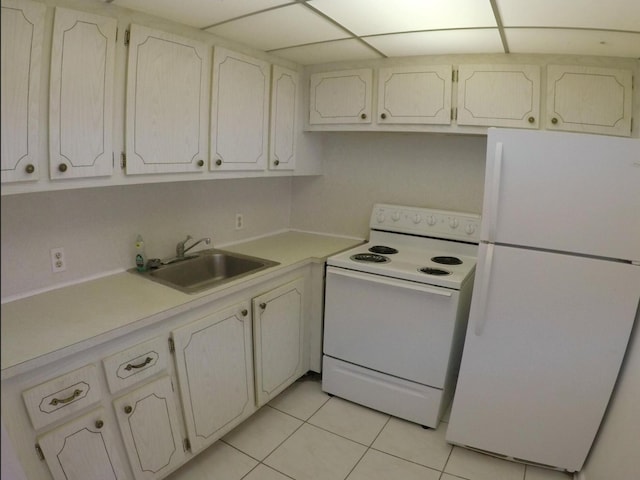 kitchen with white appliances, white cabinets, sink, and light tile floors