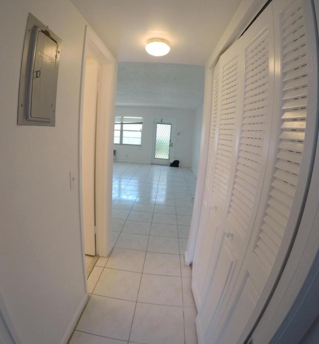 corridor with light tile flooring