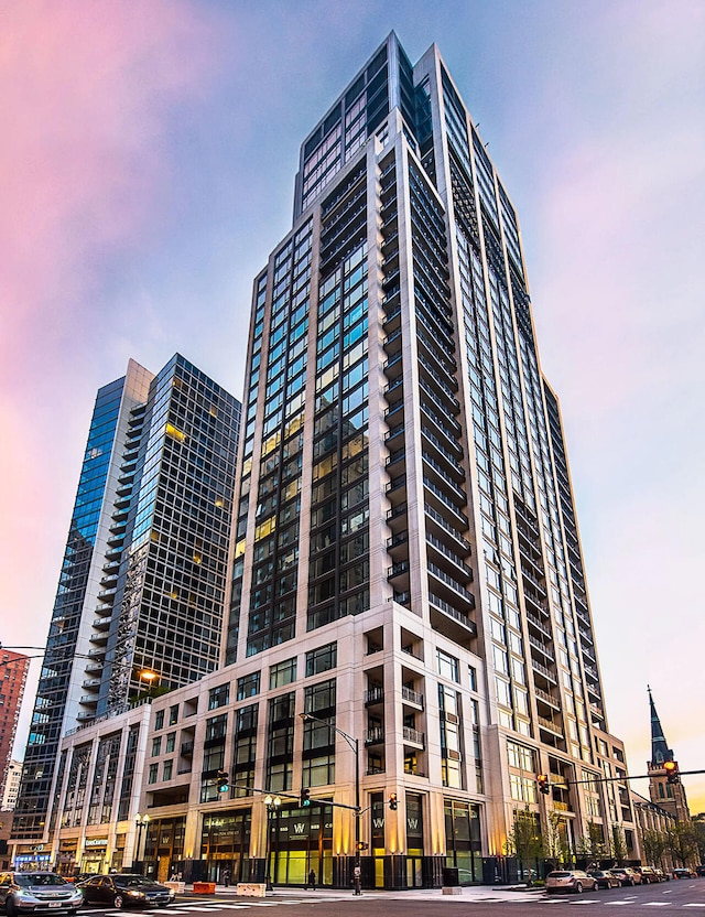 view of outdoor building at dusk