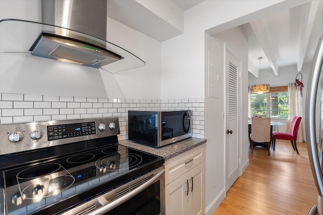 kitchen featuring ventilation hood, white cabinets, stainless steel appliances, light hardwood / wood-style floors, and backsplash