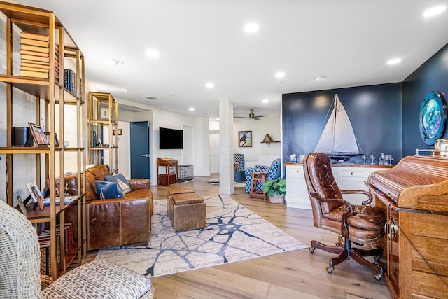 office space with ceiling fan and light wood-type flooring