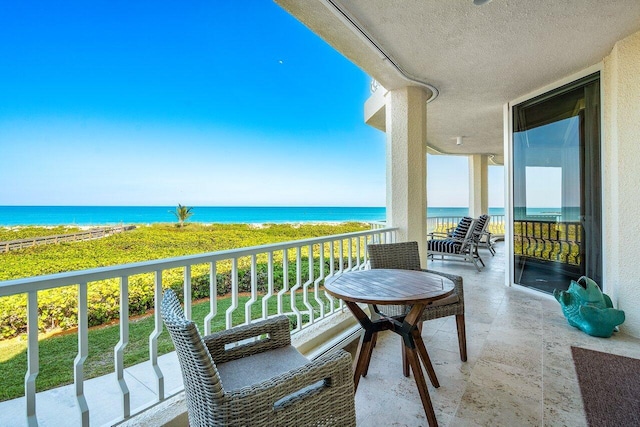 balcony featuring a water view