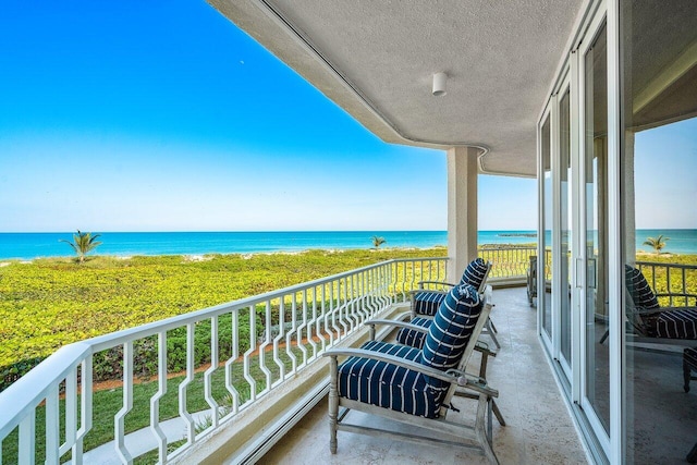 balcony featuring a water view