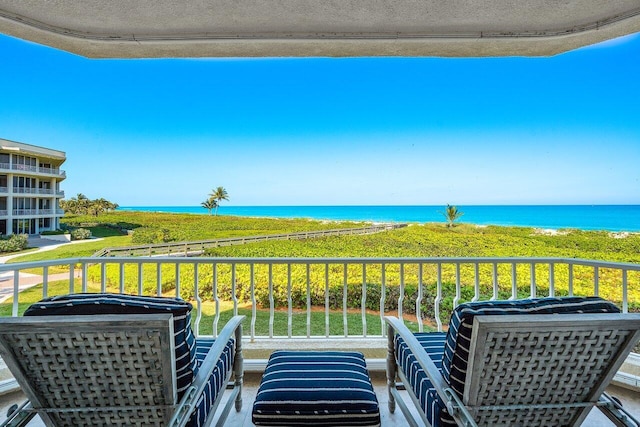 balcony featuring a water view