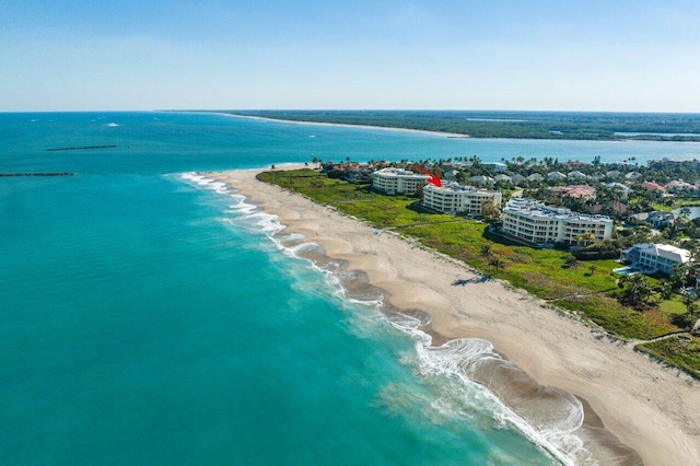 bird's eye view featuring a water view and a view of the beach