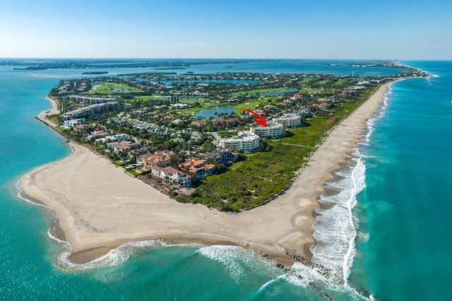 bird's eye view featuring a water view and a view of the beach