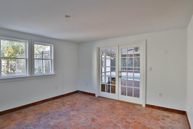 spare room featuring french doors