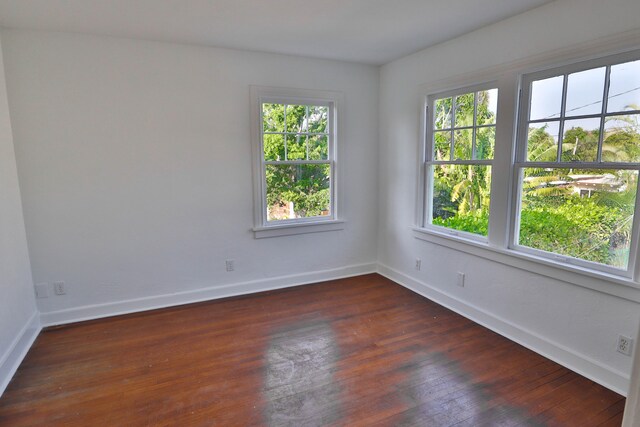 empty room with dark hardwood / wood-style floors