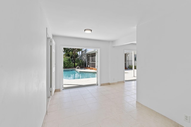 unfurnished room with light tile patterned floors