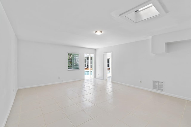 empty room featuring light tile patterned floors